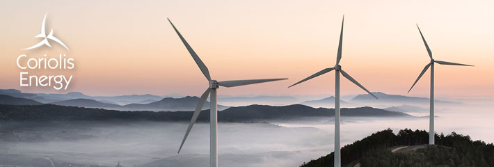 Image:  Three wind turbines on a mountain top at dawn